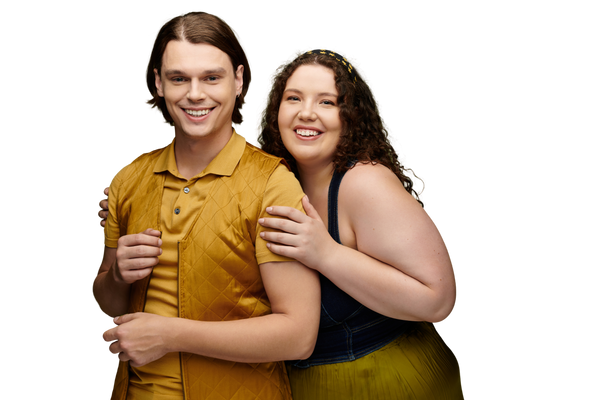 Two people hugging each other on a white background